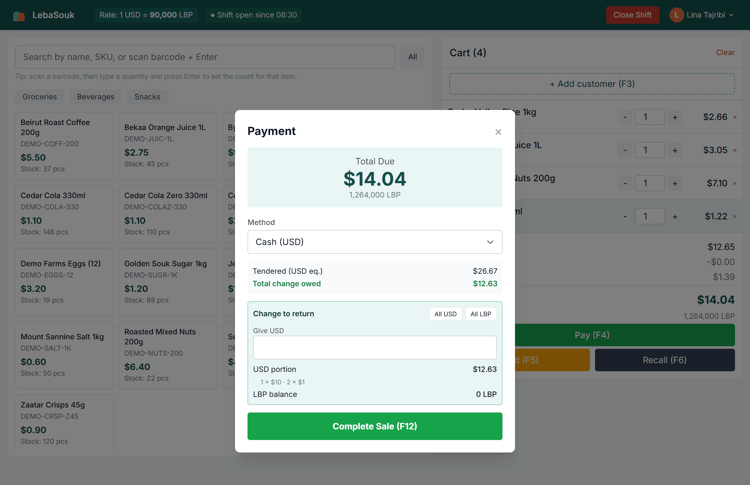 The LebaSouk payment step: $14.04 due, settled with a mix of US dollars and Lebanese pounds, and the change to return broken down into notes.